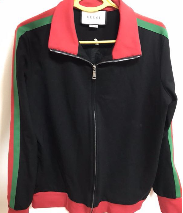 women's jacket with hues of red green black 